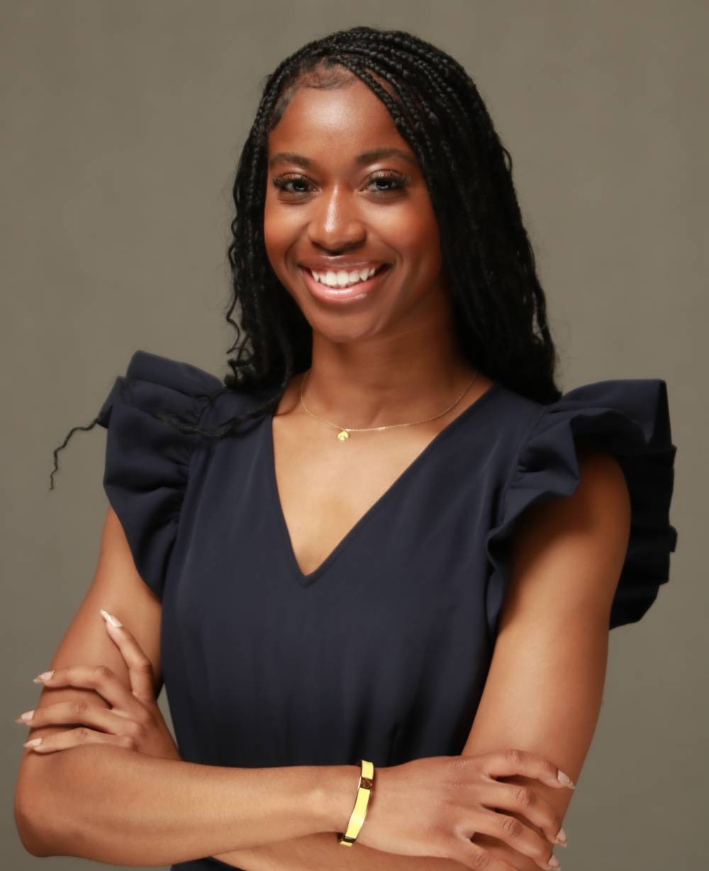 Image 1 of 2 Person wearing black and smiling